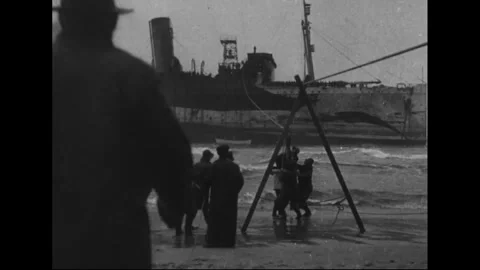 U.S. Coast Guard use a "breeches buoy" to rescue passengers 1919 Video stock 253610155