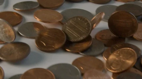 U.S. coins flipping on a table in super slow motion Stock Footage 117626251