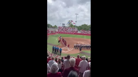 US: Crowd Helps Boy Finish National Anthem at Oklahoma Softball Game Stock Footage 335428233