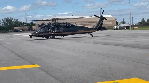 U.S. Customs and Border Protection UH-60 Blackhawk helicopter taxiing Stock Footage 290334864