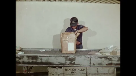 U.S. Customs Officer Opens Parcel At Post Office In Search Of Contraband Stock Footage 126109465