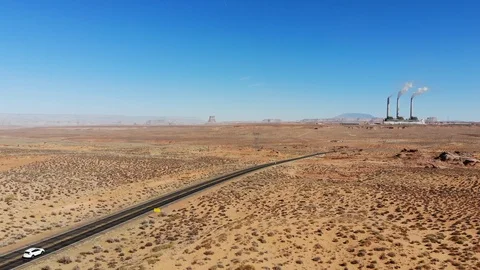US Desert car go through lost Factory Aerial Shots Stock Footage