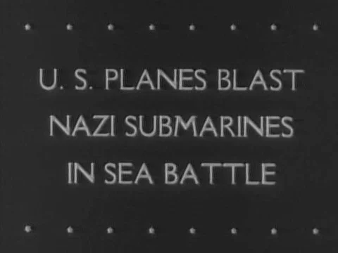U.S. dive bombers successfully fire gunfire and drop bombs on a German submarine Stock Footage 74966003