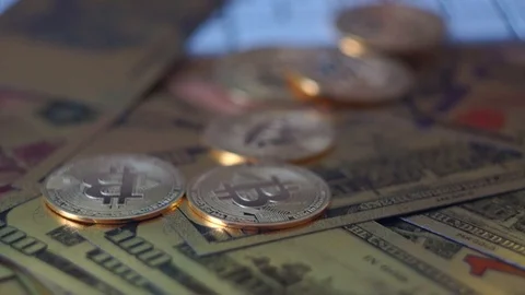 US dollar 100 banknotes and Cryptocurrency, lighting and selective focusing on Stock Footage 104192751
