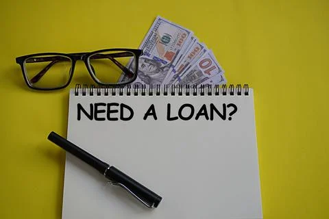 US Dollar and notebook written need a loan. Financial concept. Bank loan 스톡 사진