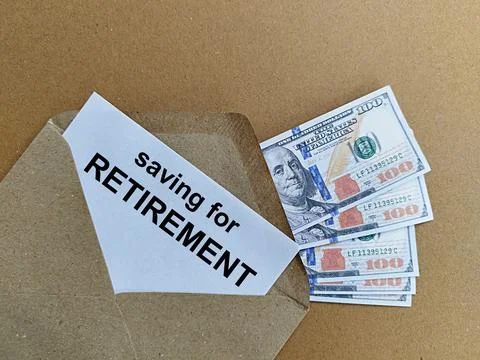 US Dollar and notes in envelope with words saving for retirement Foto stock