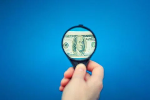 US dollar banknote under the magnifying glass Fotos Stock