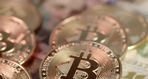 From US Dollar banknotes to Bitcoin coins. Banknotes out of focus Video stock 158655801