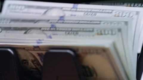 US dollar banknotes counted by automatic machine before currency exchange Stock Footage 340025308