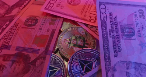 US Dollar banknotes covering Bitcoin and Ethereum cryptocurrency coins Stock Footage 177204210