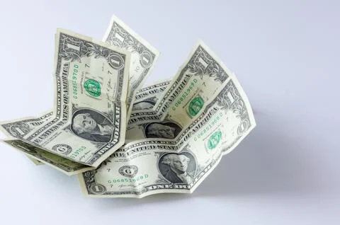 US dollar banknotes with a denomination of one dollar on a white background. Stock Photos