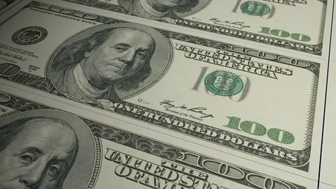 US dollar banknotes emerging from the money press Stock Footage