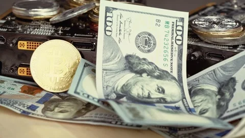 Us dollar banknotes falling onto bitcoin cryptocurrency coins and mining gr.. Stock Footage 339376549