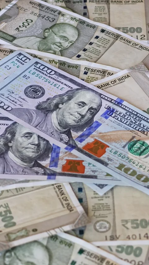 US dollar banknotes falling on Indian rupee notes Stock Footage 329671419