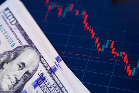 US dollar banknotes over digital screen with exchange chart, depreciation and Photos