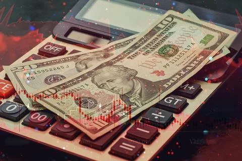 US dollar banknotes placed on a calculator with dynamic red candlestick cha.. Stock Photos