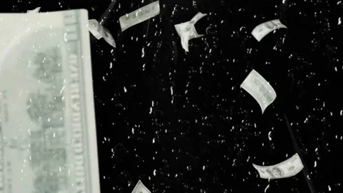 US dollar bills falling on black background Stock Footage 340613336