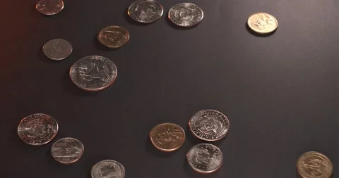 US Dollar coins on black surface. Half Dollar and one Dollar coins Stock-Footage 172116746