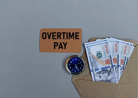 Us Dollar in envelope, clock and overtime pay printout Foto stock
