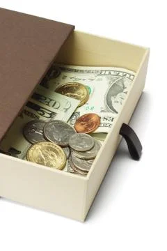 Us dollar notes and coins in gift box Stock Photos