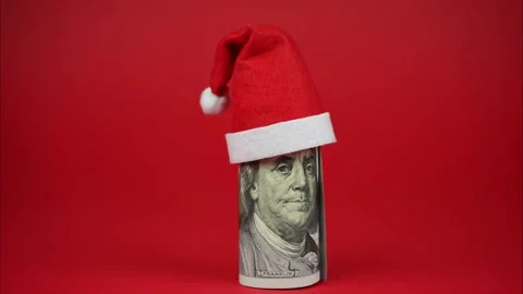 The US dollar notes different denomination with santa claus hat. Stop motion Stock Footage 257353408