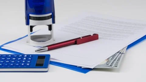 US dollar under documents Stock Photos