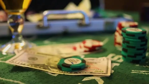 Us dollars and poker chips on table near case Stock Footage 276377337