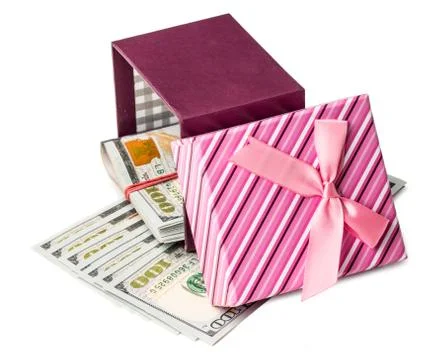 U.S. dollars banknotes laying in red bow decorated gift box. Foto stock