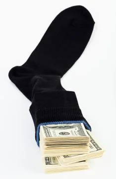 Us dollars bundle hidden in black sock Stockfoto's