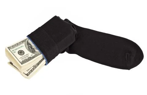 Us dollars bundle hidden in black sock Stock Photos