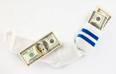 Us dollars bundle hidden in white sock Stockfoto's