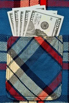 US dollars notes in work shirt pocket Stock Photos
