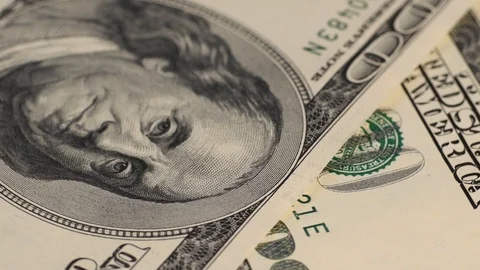 US dollars rotating Stock Footage 107516362