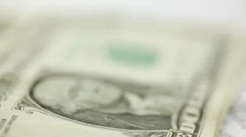 U.S. dollars stacked next to U.S. tax form - panning shot 스톡 동영상 306110