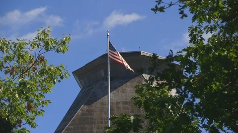 US embassy in Ottawa - low angle view of US flag and rooftop tower Stockbeeldmateriaal 96490323