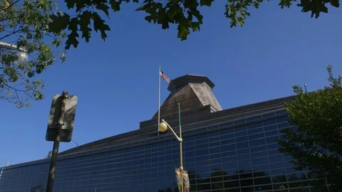 US embassy in Ottawa - wide to medium view of US flag and rooftop tower Stock Footage 96489719
