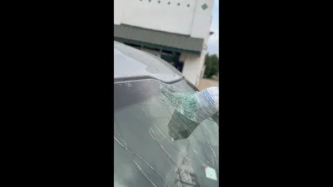 US: Exploded aerosol can leaves windshield shattered in Oklahoma, USA Stock Footage 341446975