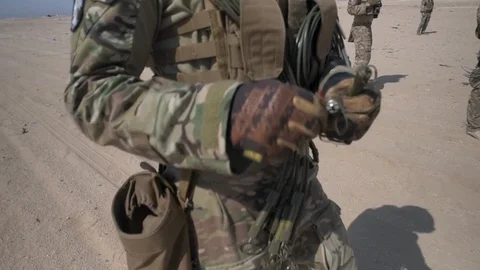 U.S. explosives Airman pulling EOD fuse in desert during training in Kuwait Video stock 120116095