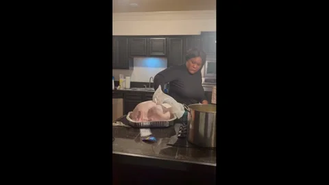 US: First-time turkey prep turns hilarious in Little Rock, USA Stock Footage 322790055