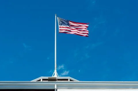 US flag against sky Stock Photos