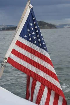 US Flag with Alcatraz in the background Stock Photos