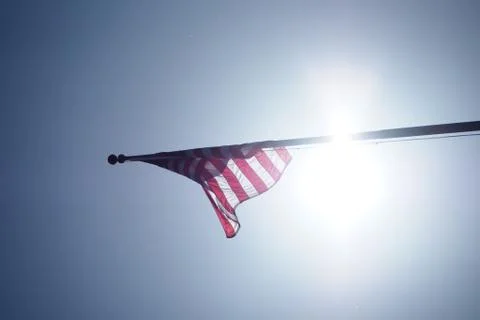US Flag, Backlit on Flagpole Stock Photos