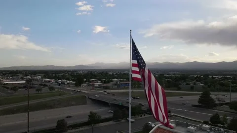 US Flag blowing in the wind from a drones aerial perspective Stock Footage 154418719