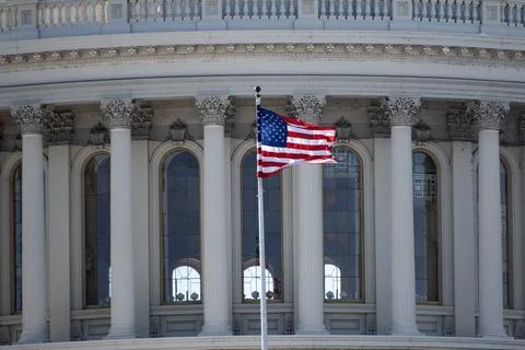 US flag on Capitol with dome architecture. Capitol with American flag near la Stock Photos