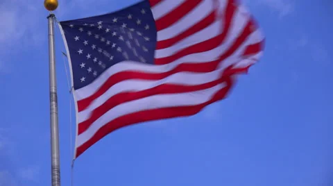The U.S. flag flies in the wind. Stock Footage 55657392