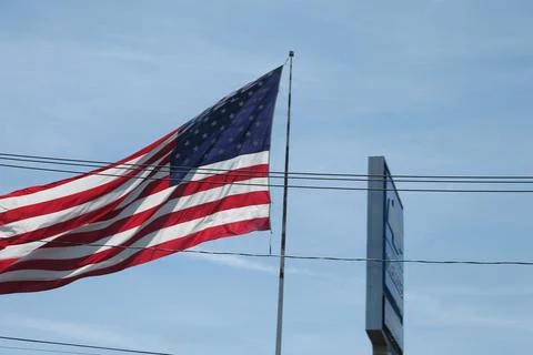 U.S. Flag fluttering in the wind Stock Photos