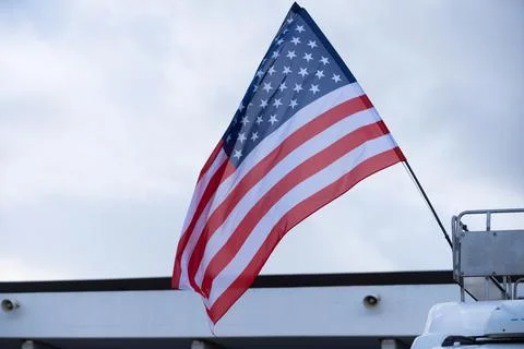 The US flag fluttering in the wind Stock Photos