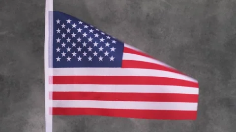 The US flag flutters in the wind. Stock Footage 248627296
