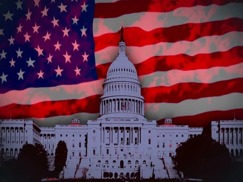 US flag flying behind Capitol Building Stock Footage 70900851
