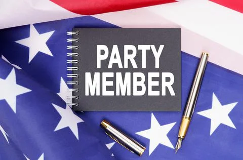 The US flag has a pen and a notebook with the inscription - PARTY MEMBER Fotos Stock